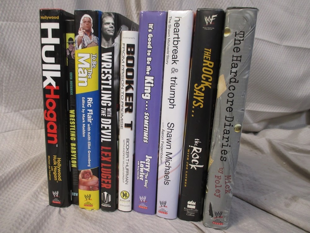 Lot of 9 WWE Pro Wrestling Books including Hulk Hogan The Rock and Others